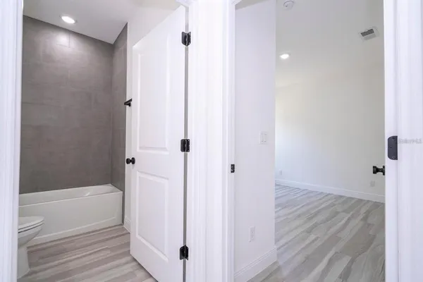 a bathroom with a bathtub and a shower