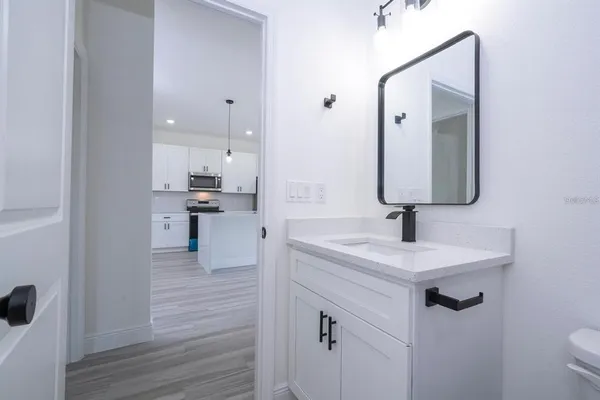 a en suite bathroom with a sink and mirror