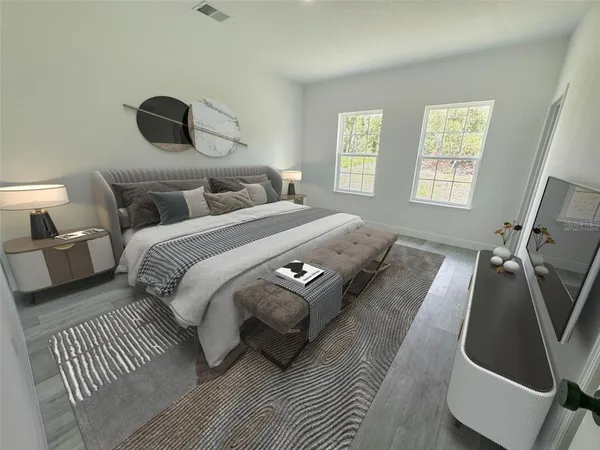 a bedroom with a bed and a large mirror