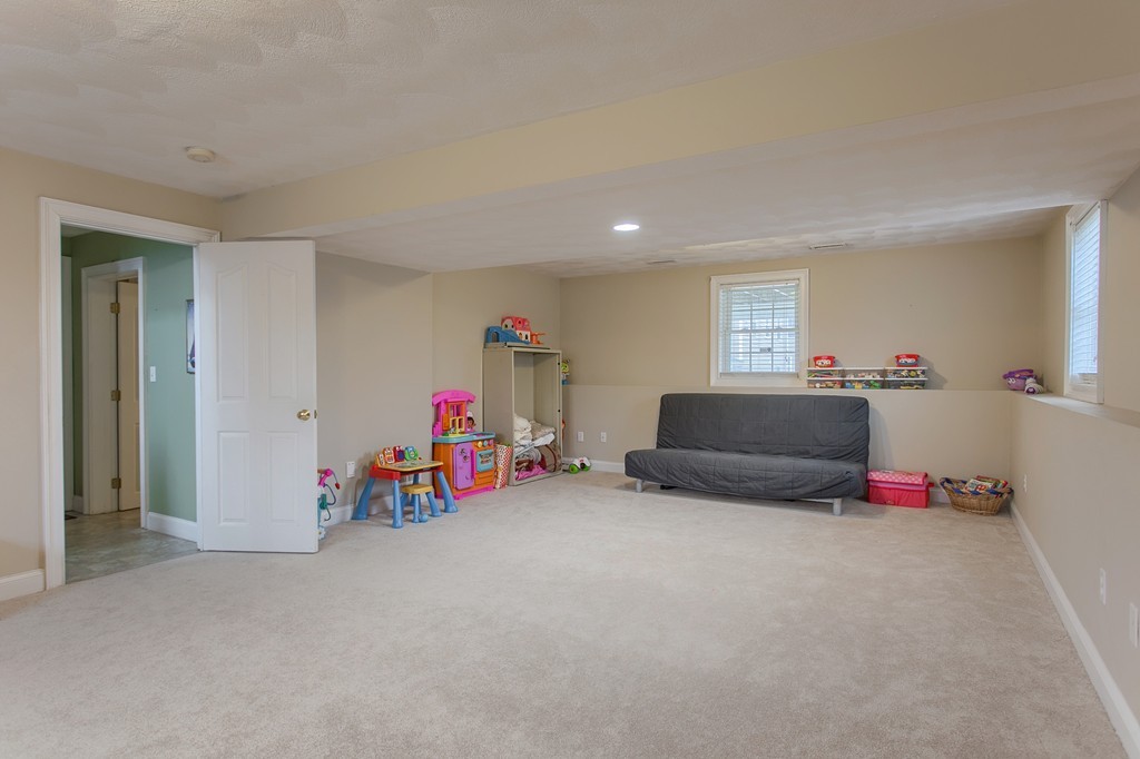 918 Boston Road Billerica, MA 01821 - Photo 15 of 16 a living room with furniture and a flat screen tv