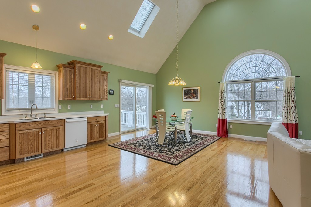 918 Boston Road Billerica, MA 01821 - Photo 2 of 16 a large kitchen with cabinets wooden floor and stainless steel appliances