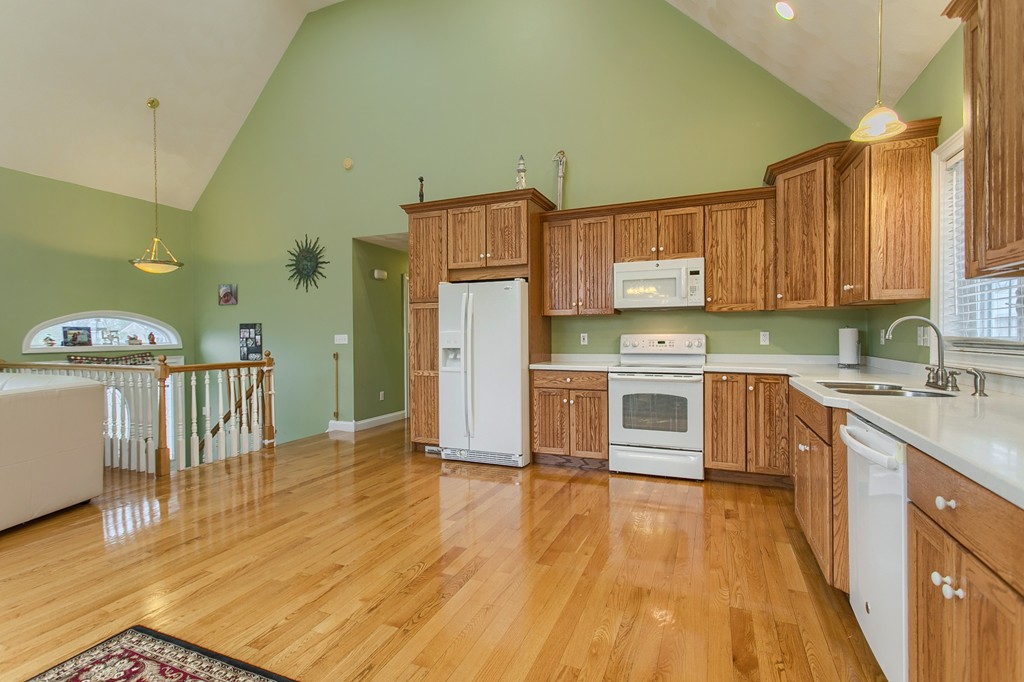 918 Boston Road Billerica, MA 01821 - Photo 8 of 16 a kitchen with stainless steel appliances a stove a sink a refrigerator and cabinets