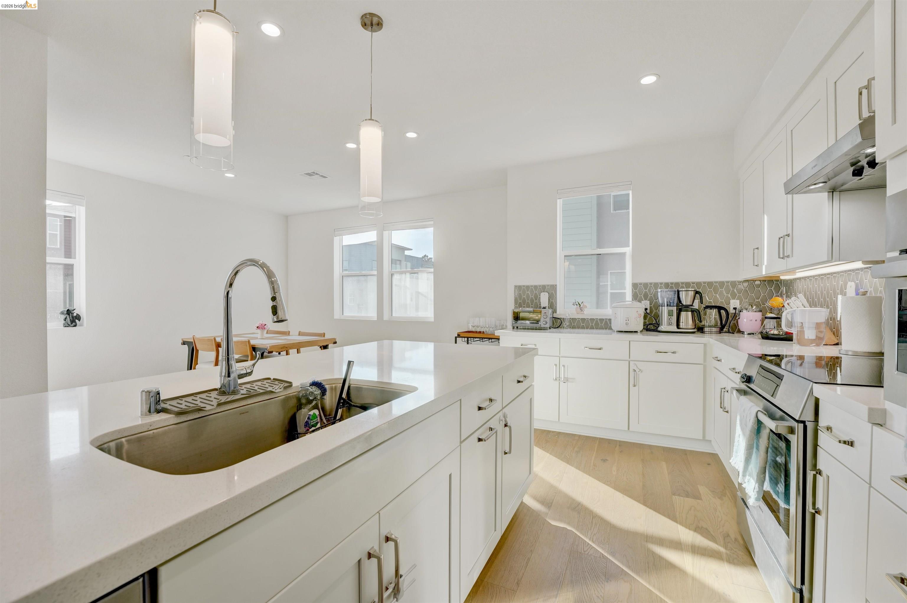7101 Melon Court San Ramon, CA 94583 - Photo 23 of 58 a kitchen with counter top space cabinets and stainless steel appliances