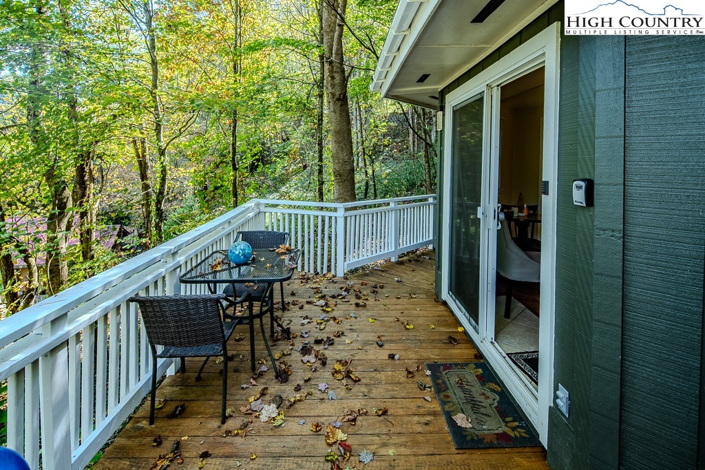 111 Skyview Lane Banner Elk, NC 28604 - Photo 14 of 31 a view of balcony with wooden floor and fence