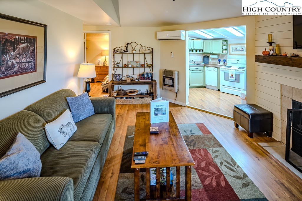 111 Skyview Lane Banner Elk, NC 28604 - Photo 4 of 31 a living room with furniture fireplace and flat screen tv