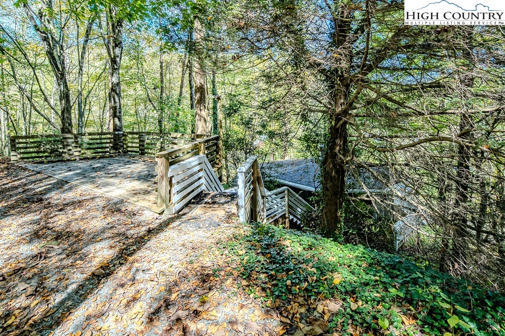 111 Skyview Lane Banner Elk, NC 28604 - Photo 8 of 31 a backyard of a house with lots of green space