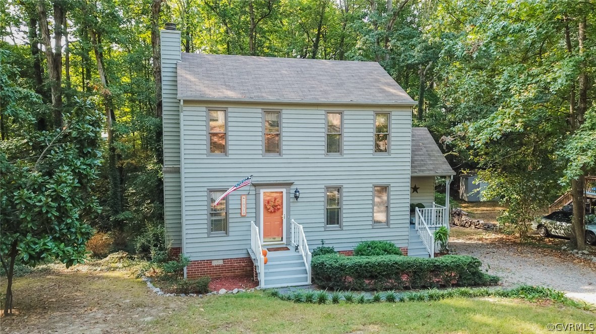 10319 Natural Bridge Road Chesterfield, VA 23236 - Photo 1 of 25 a view of a house with a yard and plants