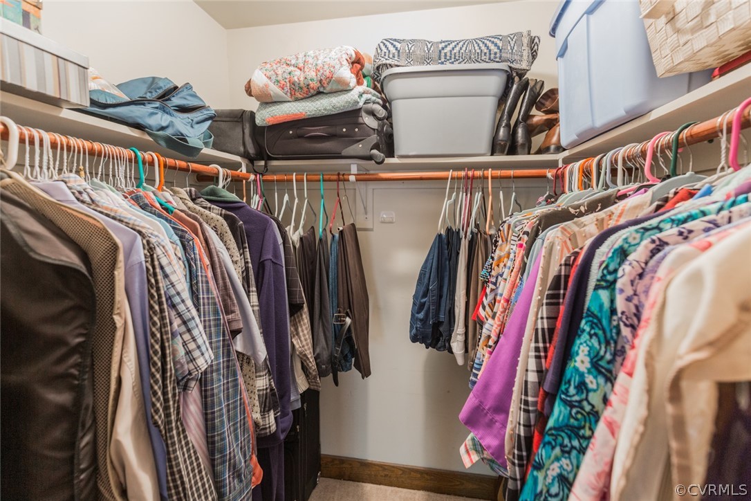 10319 Natural Bridge Road Chesterfield, VA 23236 - Photo 14 of 25 a view of walk in closet with clothes and shoes