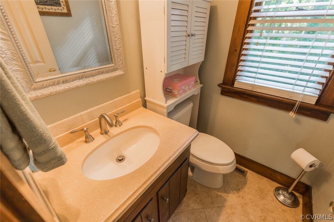 10319 Natural Bridge Road Chesterfield, VA 23236 - Photo 15 of 25 a bathroom with a sink and toilet