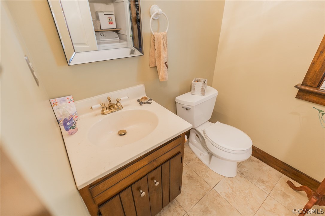 10319 Natural Bridge Road Chesterfield, VA 23236 - Photo 10 of 25 a white toilet sitting next to a bathroom sink