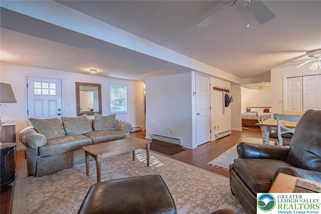 a view of a dining room with furniture and wooden floor