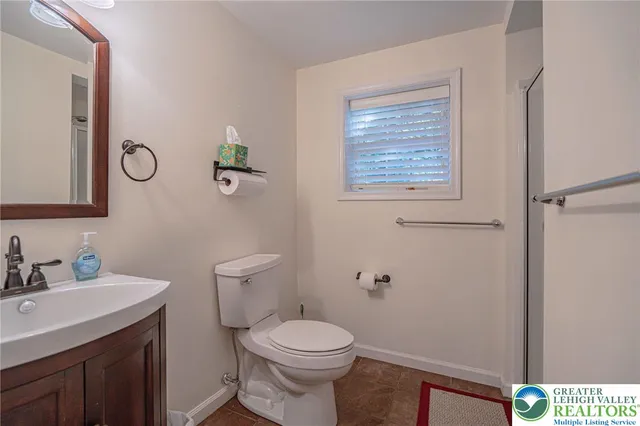 a bedroom with a bed and a mirror