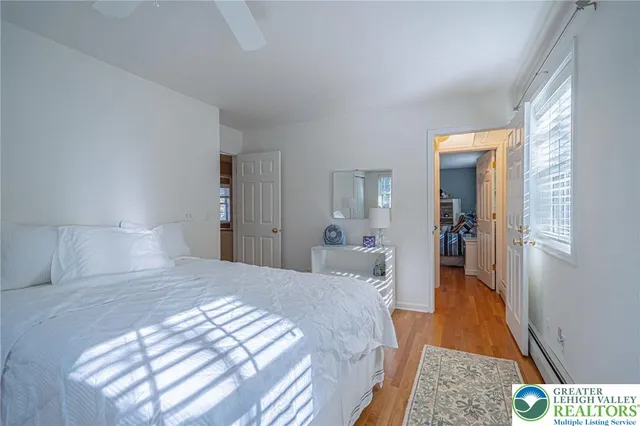 a view of a lake with houses in the back