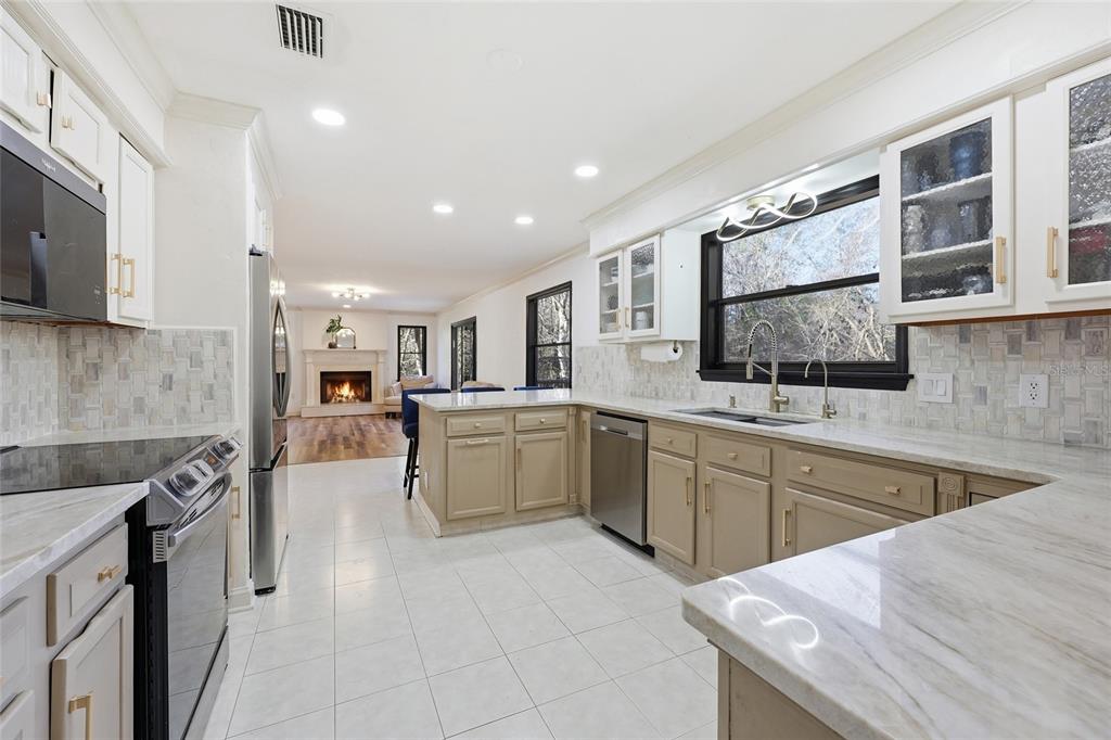 6612 Northwest 44th Place Gainesville, FL 32606 - Photo 13 of 34 a kitchen with sink cabinets and window