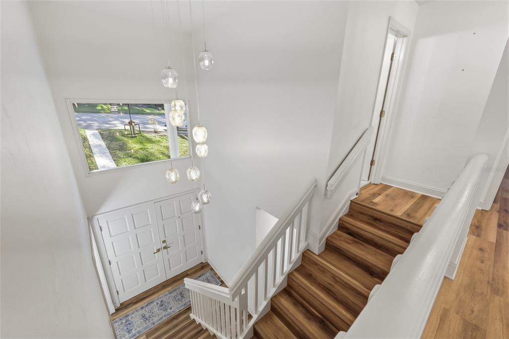 6612 Northwest 44th Place Gainesville, FL 32606 - Photo 16 of 34 a view of entryway and hall with wooden floor