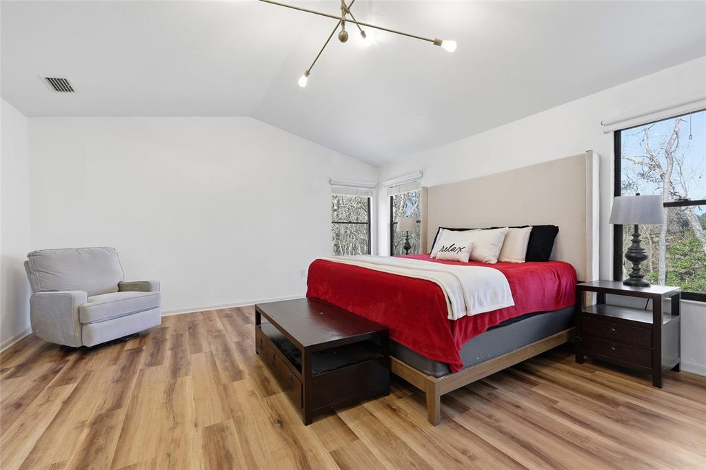 6612 Northwest 44th Place Gainesville, FL 32606 - Photo 17 of 34 a bedroom with a bed and chair