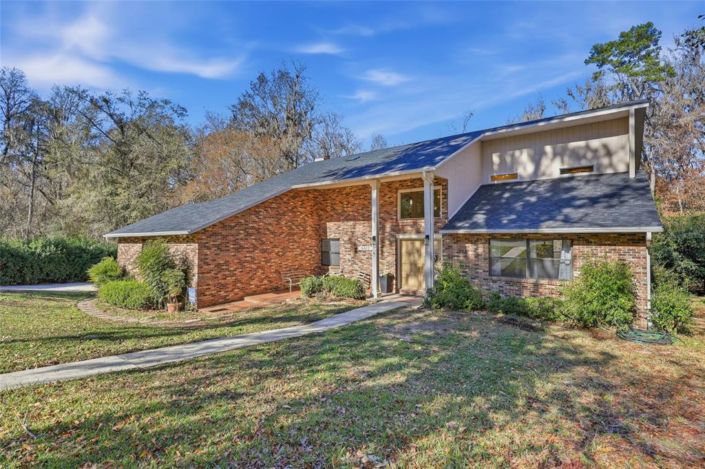6612 Northwest 44th Place Gainesville, FL 32606 - Photo 2 of 34 a view of a house with a yard