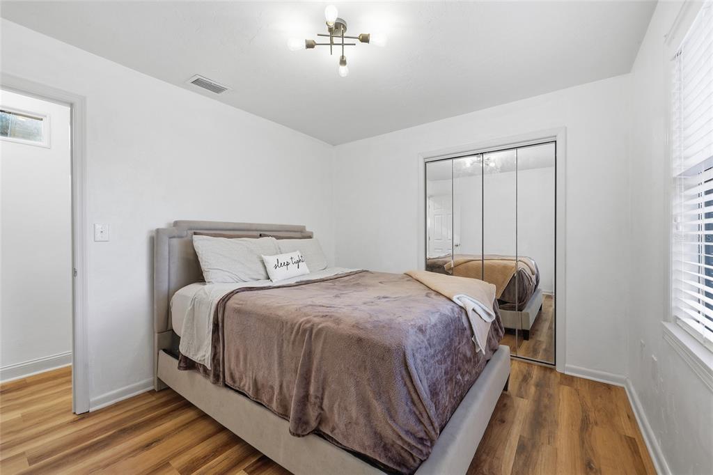 6612 Northwest 44th Place Gainesville, FL 32606 - Photo 22 of 34 a bedroom with a bed and a window