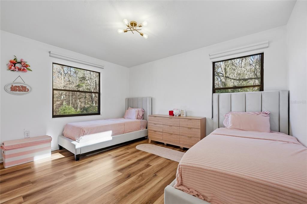 6612 Northwest 44th Place Gainesville, FL 32606 - Photo 24 of 34 a bedroom with a bed and a window