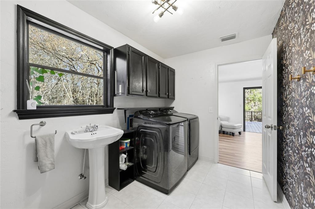 6612 Northwest 44th Place Gainesville, FL 32606 - Photo 26 of 34 a view of a hallway with washer and dryer