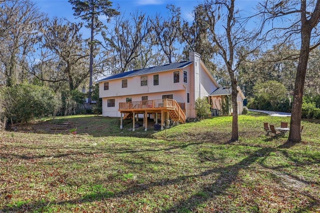 6612 Northwest 44th Place Gainesville, FL 32606 - Photo 30 of 34 a view of a house with backyard and a tree
