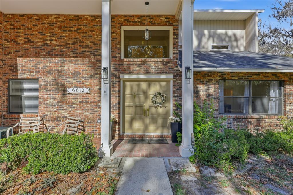 6612 Northwest 44th Place Gainesville, FL 32606 - Photo 3 of 34 a view of a entryway door front of house