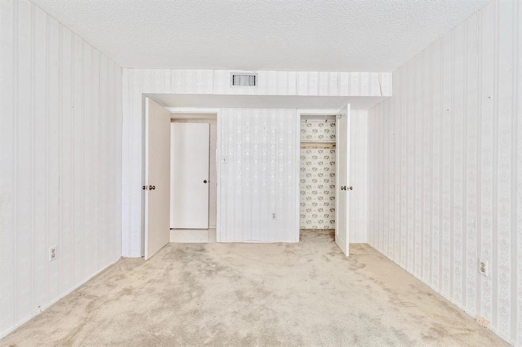 18031 Biscayne Boulevard, Unit 1104 Aventura, FL 33160 - Photo 11 of 35 an empty room with closet