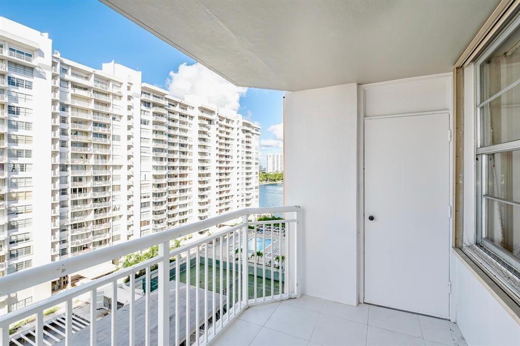 18031 Biscayne Boulevard, Unit 1104 Aventura, FL 33160 - Photo 19 of 35 a view of a balcony with wooden floor