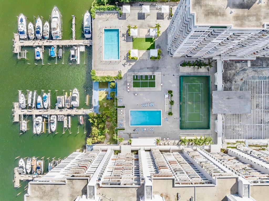 18031 Biscayne Boulevard, Unit 1104 Aventura, FL 33160 - Photo 20 of 35 a view of multiple houses with a yard