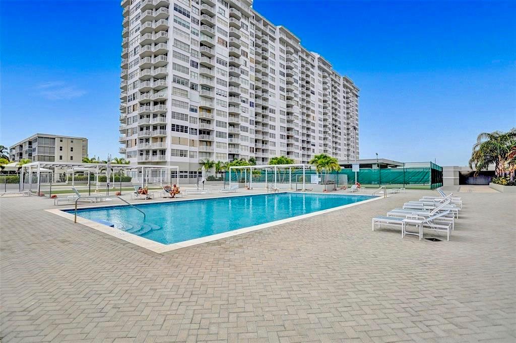 18031 Biscayne Boulevard, Unit 1104 Aventura, FL 33160 - Photo 21 of 35 a view of swimming pool with outdoor space and seating area