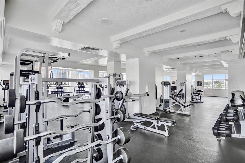 18031 Biscayne Boulevard, Unit 1104 Aventura, FL 33160 - Photo 24 of 35 a view of a room with gym equipment