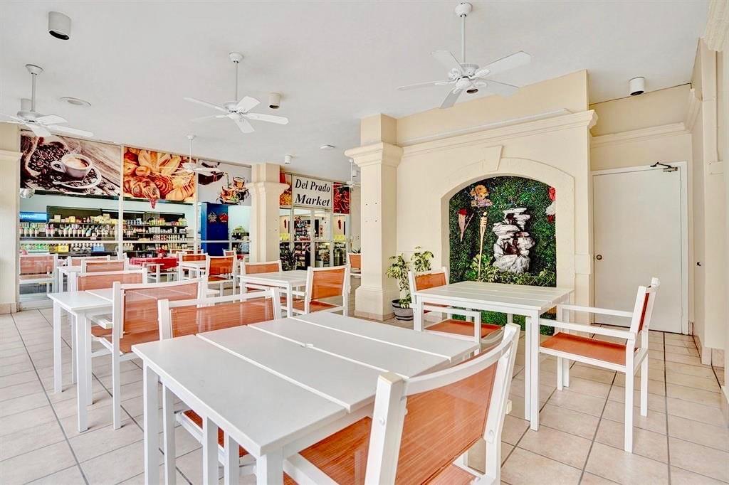 18031 Biscayne Boulevard, Unit 1104 Aventura, FL 33160 - Photo 27 of 35 a living room with stainless steel appliances furniture and a kitchen view