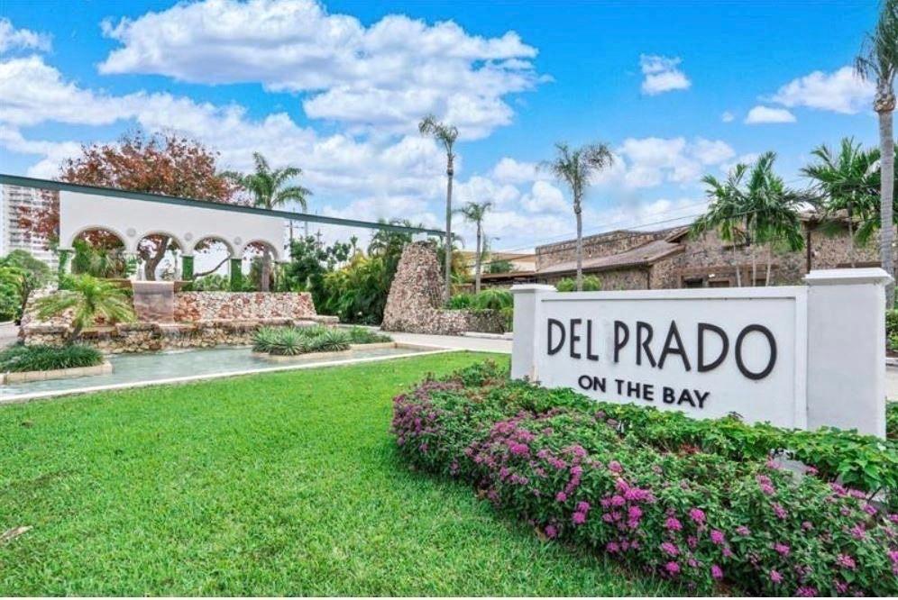 18031 Biscayne Boulevard, Unit 1104 Aventura, FL 33160 - Photo 32 of 35 a sign that is sitting in front of flowers