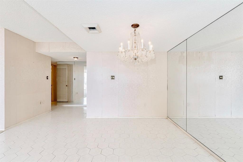 18031 Biscayne Boulevard, Unit 1104 Aventura, FL 33160 - Photo 7 of 35 a view of a chandelier in big room and chandelier