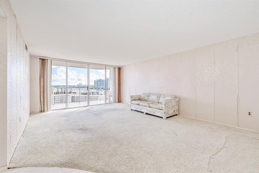 18031 Biscayne Boulevard, Unit 1104 Aventura, FL 33160 - Photo 8 of 35 a view of an empty room with a window