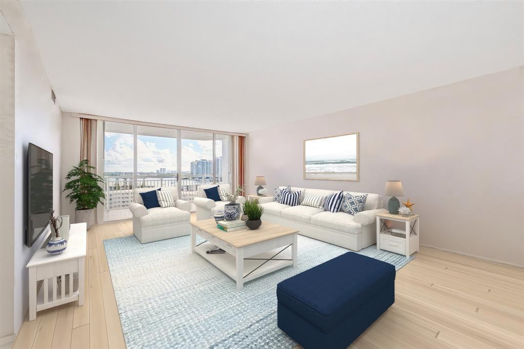 18031 Biscayne Boulevard, Unit 1104 Aventura, FL 33160 - Photo 9 of 35 a living room with furniture and a large window