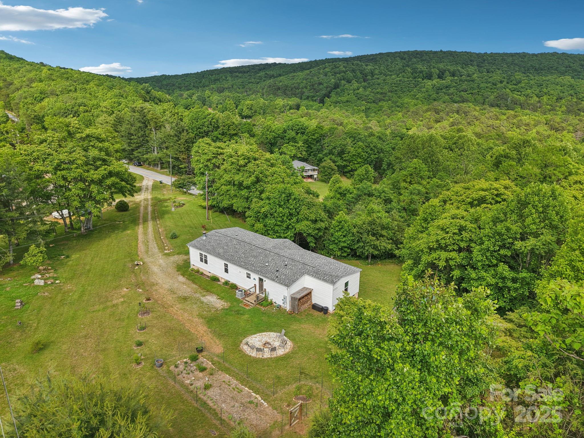 1282 Spicer Cove Road Hendersonville, NC 28792 - Photo 1 of 42 a view of a big yard with swimming pool