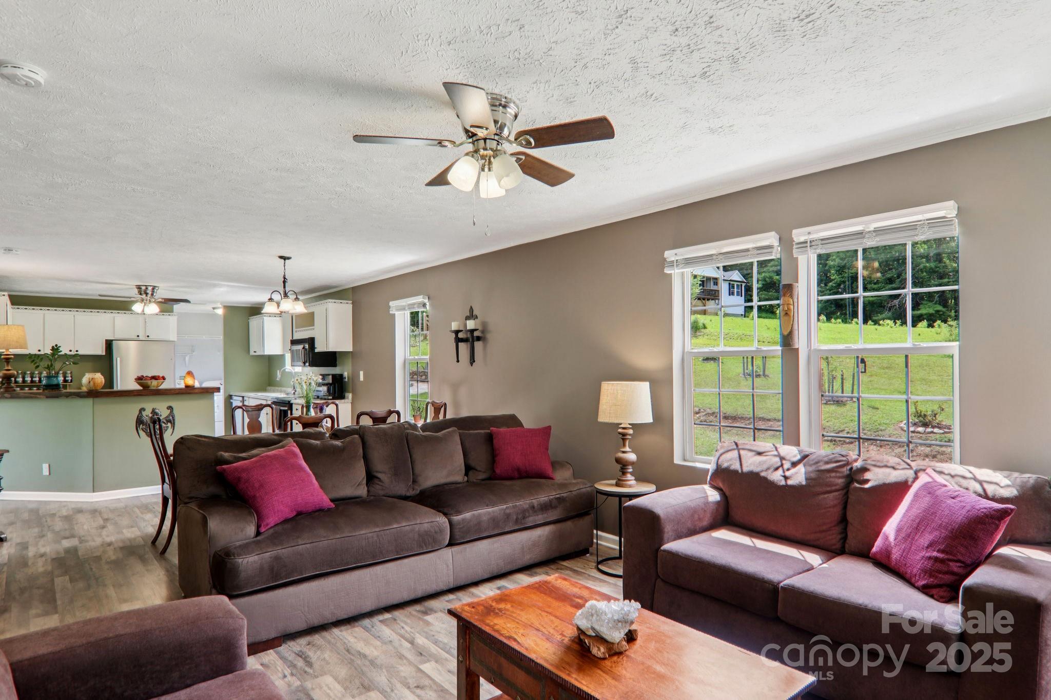 1282 Spicer Cove Road Hendersonville, NC 28792 - Photo 11 of 42 a living room with furniture and a large window