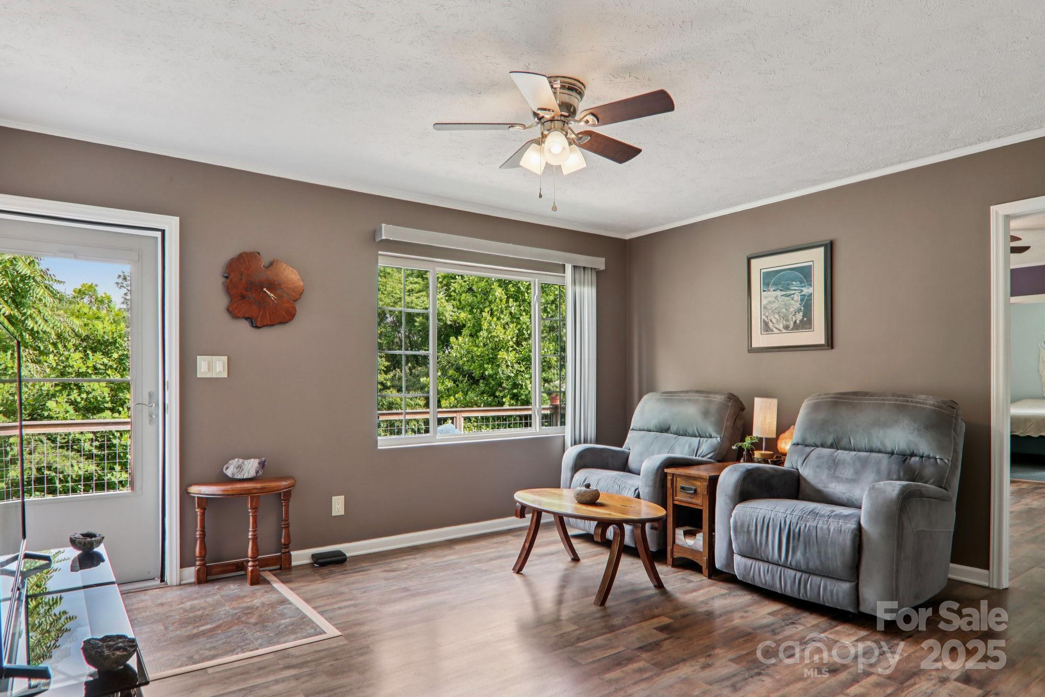 1282 Spicer Cove Road Hendersonville, NC 28792 - Photo 12 of 42 a living room with furniture and a window