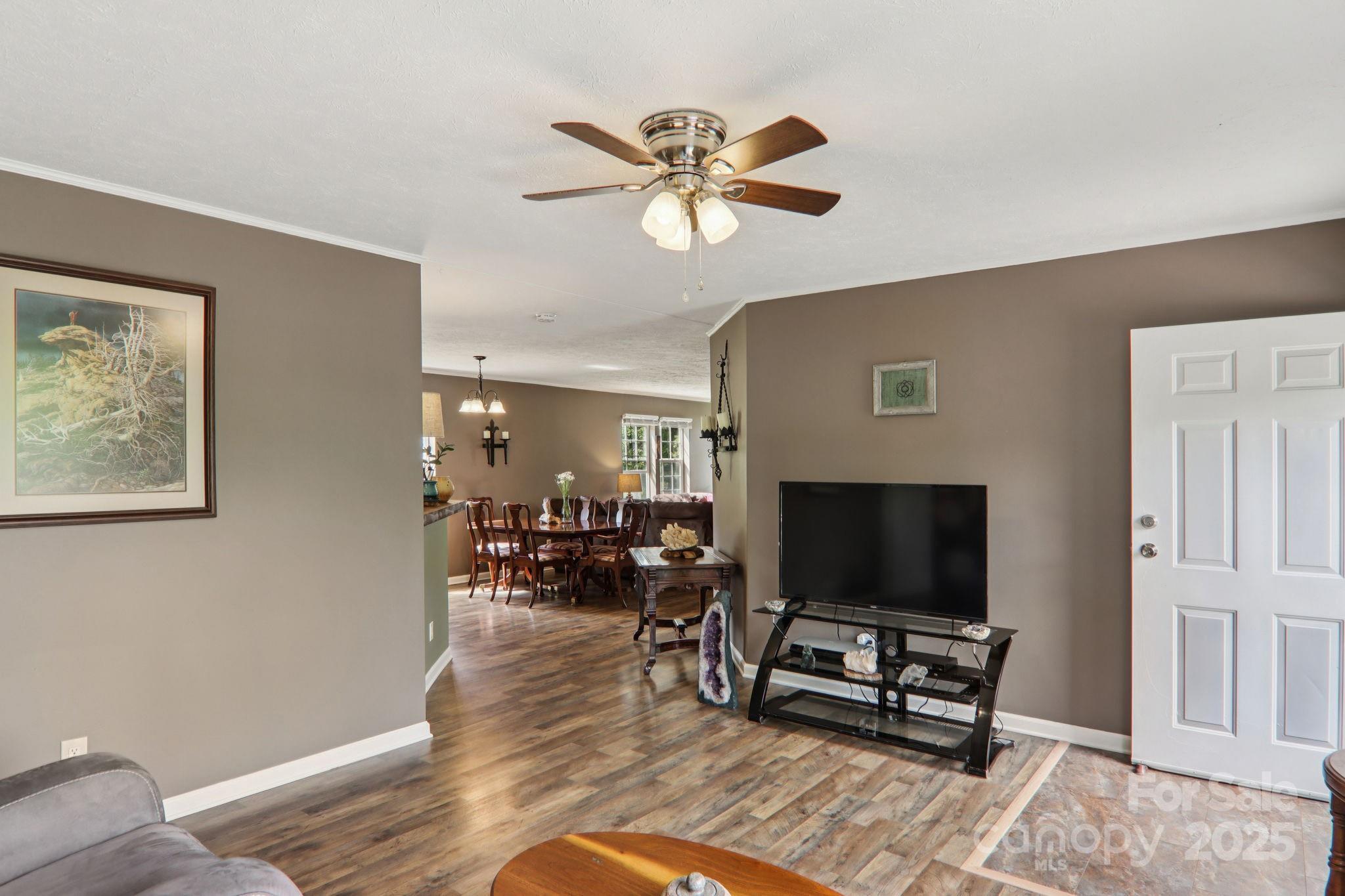 1282 Spicer Cove Road Hendersonville, NC 28792 - Photo 14 of 42 a living room with furniture and a flat screen tv