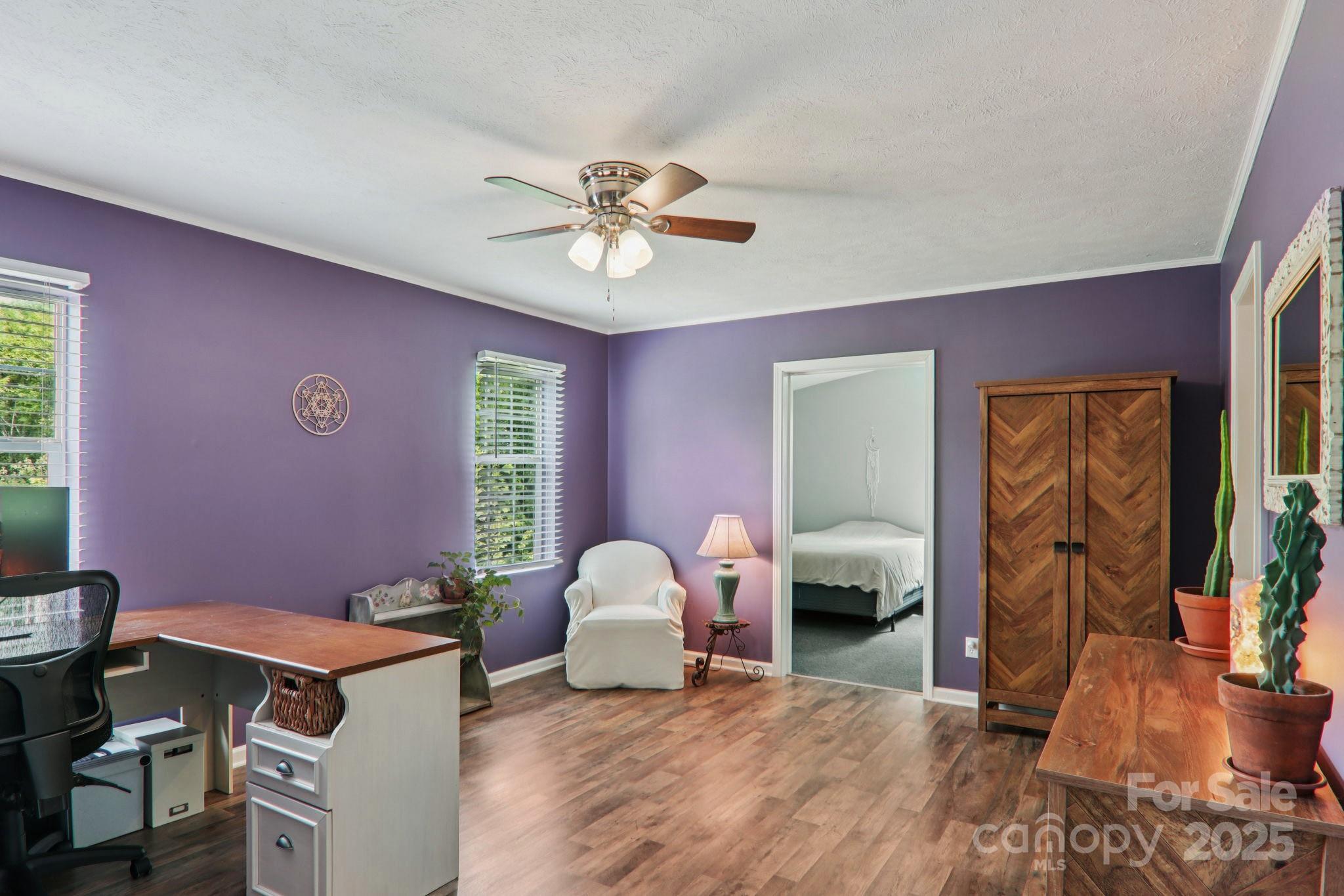 1282 Spicer Cove Road Hendersonville, NC 28792 - Photo 15 of 42 a bedroom with furniture and a chandelier