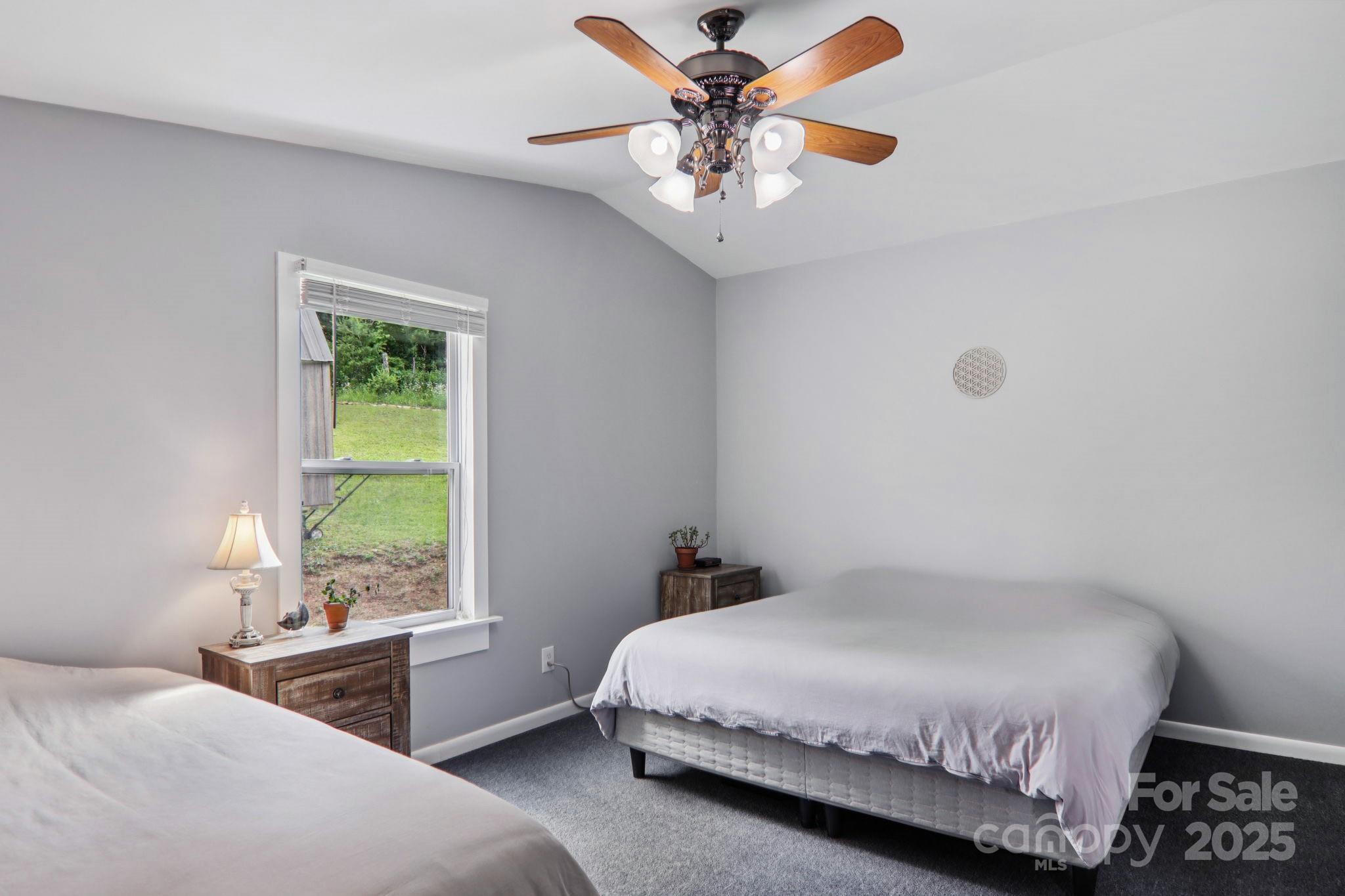 1282 Spicer Cove Road Hendersonville, NC 28792 - Photo 17 of 42 a bedroom with a bed and a window