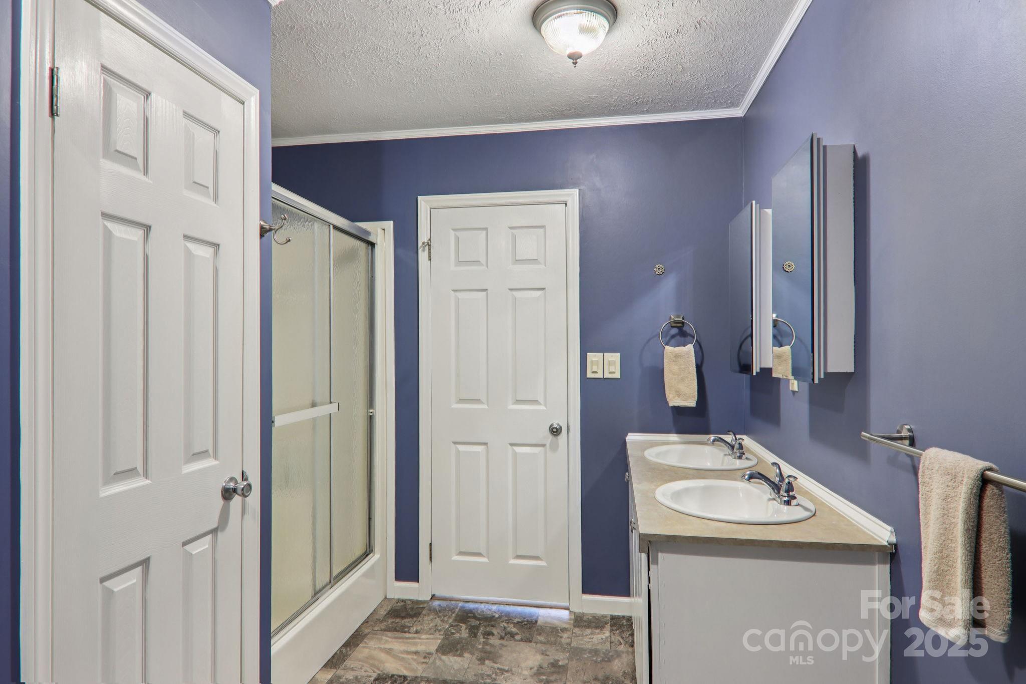 1282 Spicer Cove Road Hendersonville, NC 28792 - Photo 19 of 42 a bathroom with a sink and a washing machine