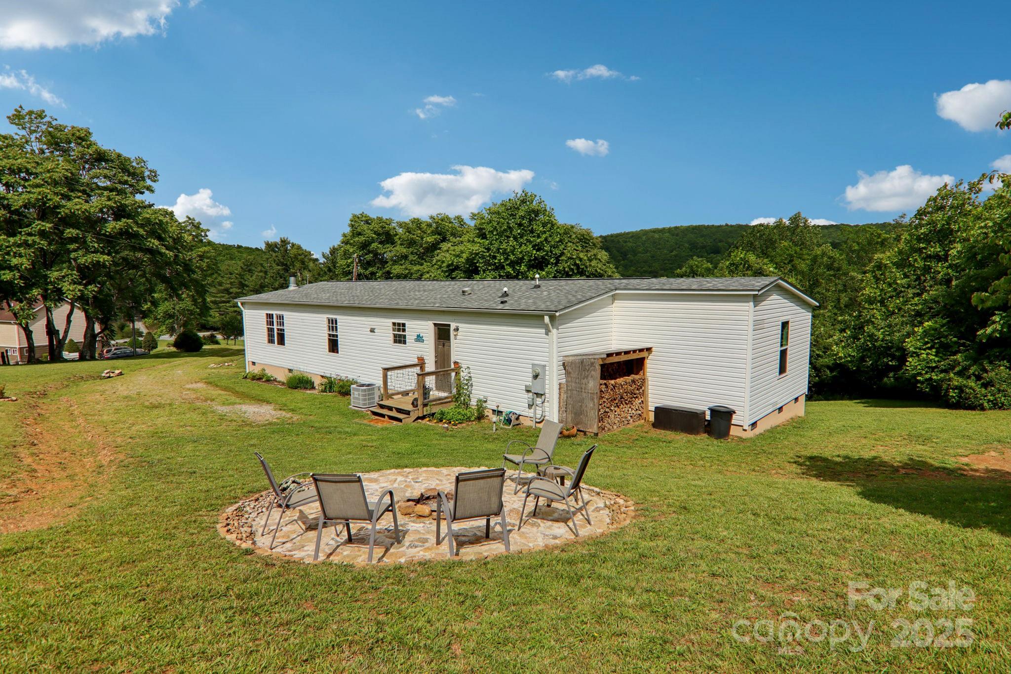 1282 Spicer Cove Road Hendersonville, NC 28792 - Photo 2 of 42 a view of a house with backyard and garden