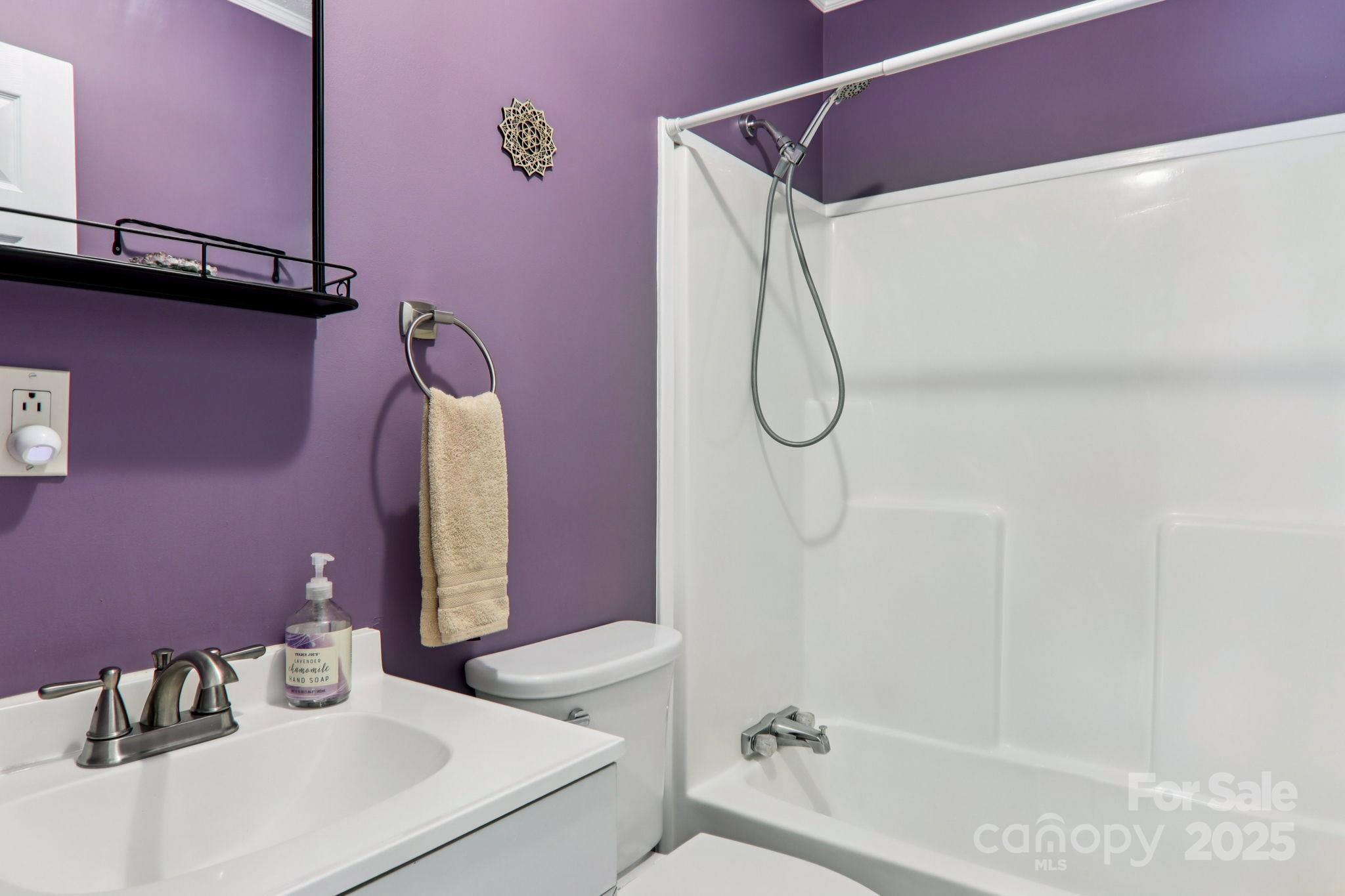 1282 Spicer Cove Road Hendersonville, NC 28792 - Photo 22 of 42 a bathroom with a sink vanity and shower