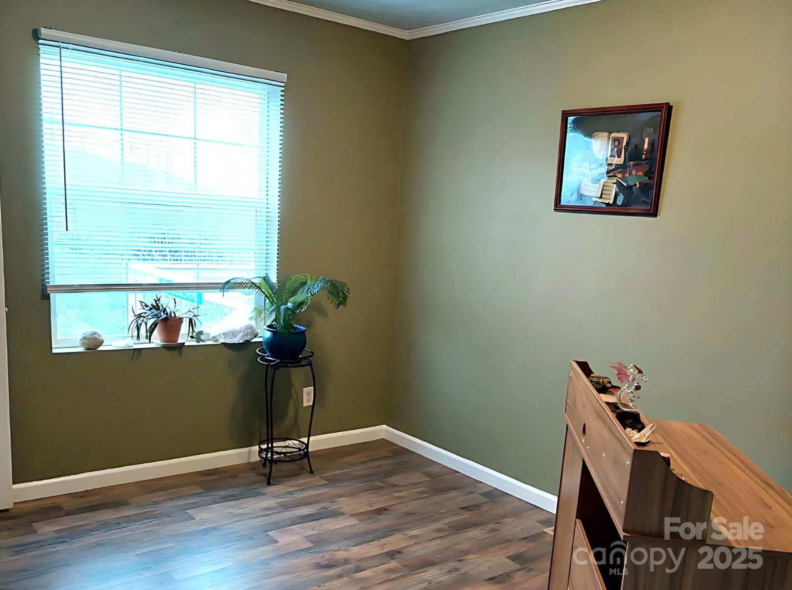 1282 Spicer Cove Road Hendersonville, NC 28792 - Photo 23 of 42 a view of a workspace with furniture and a window