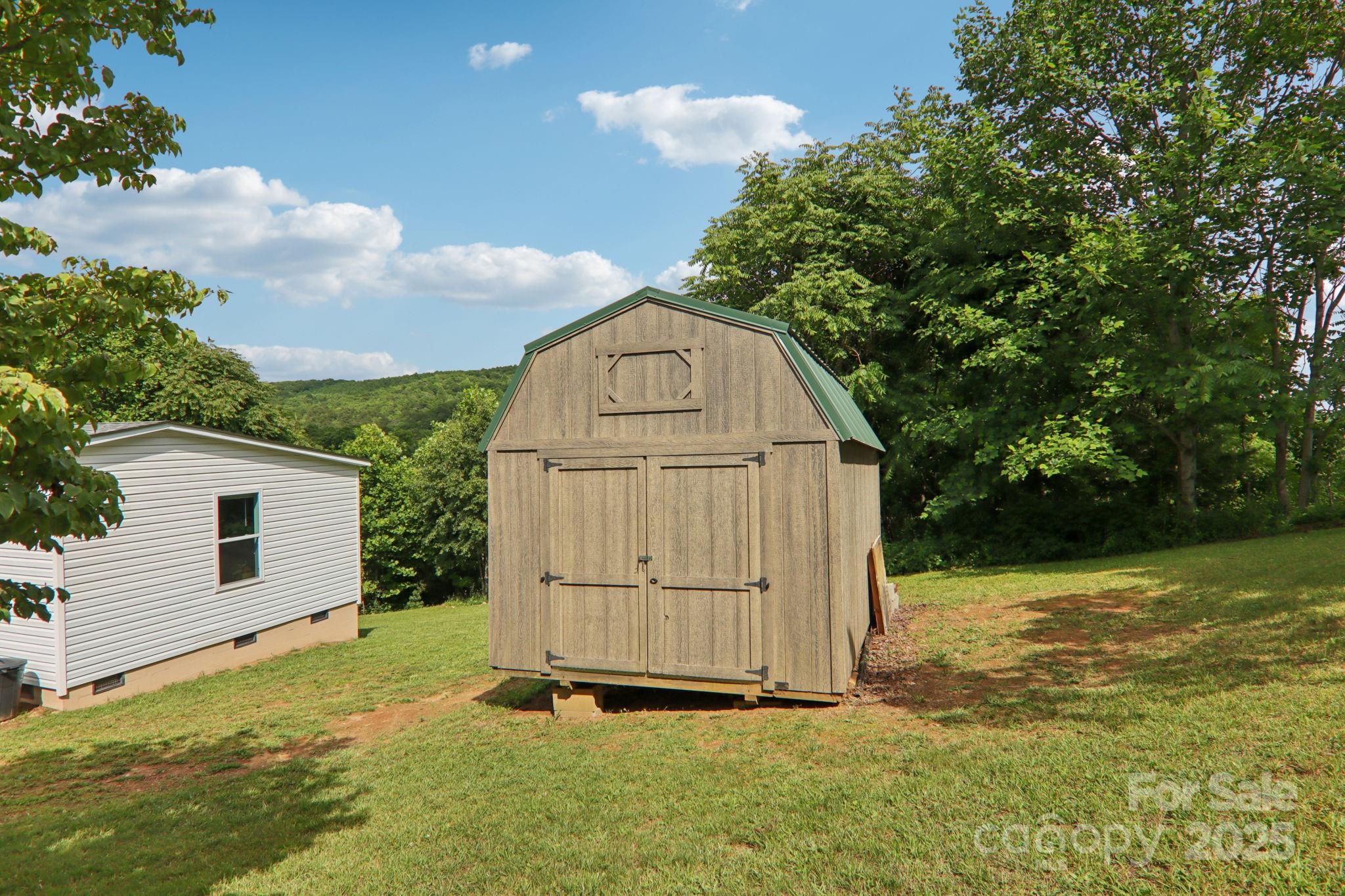 1282 Spicer Cove Road Hendersonville, NC 28792 - Photo 35 of 42 a view of backyard with small garden