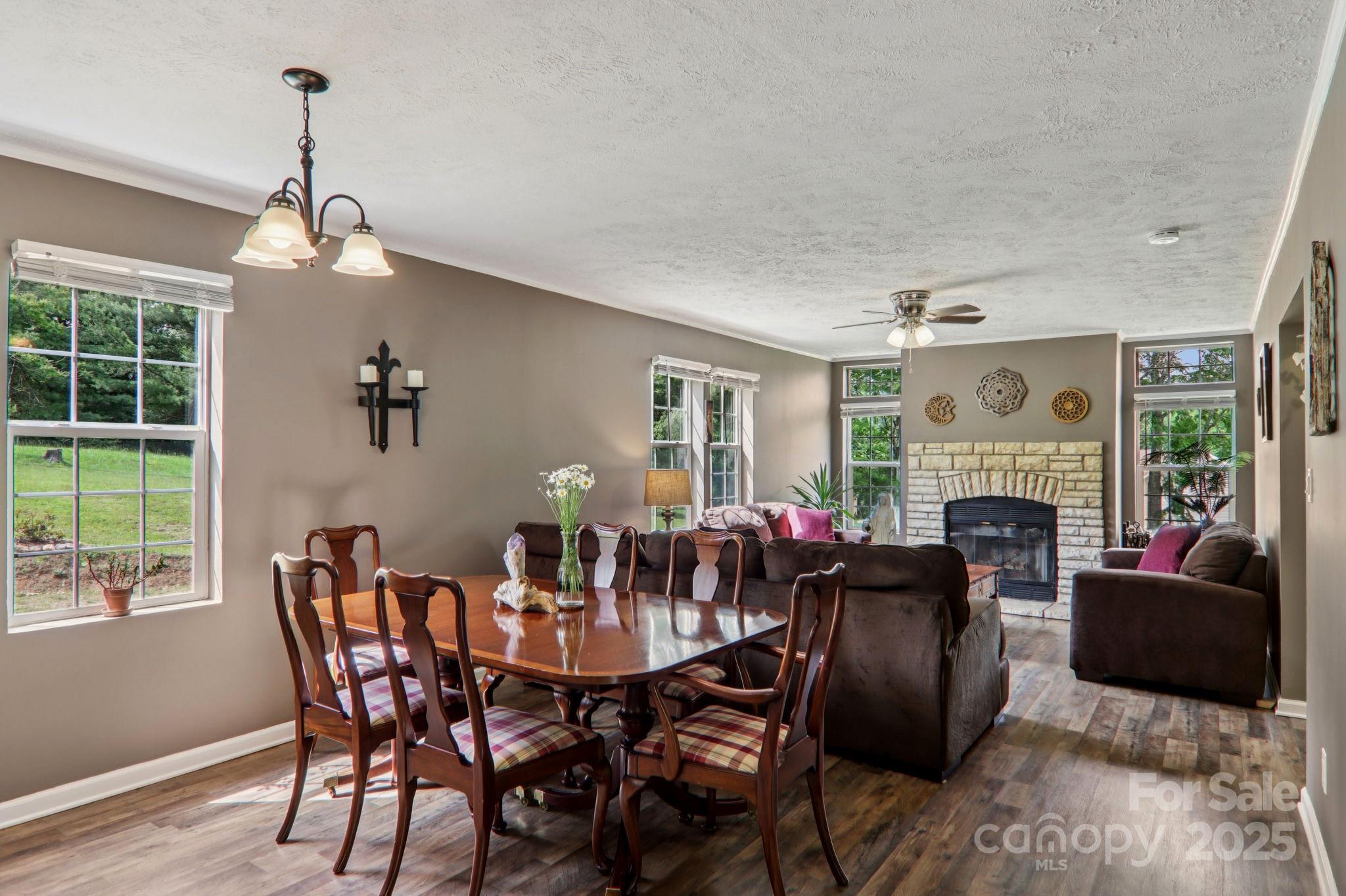 1282 Spicer Cove Road Hendersonville, NC 28792 - Photo 10 of 42 a view of a dining room with furniture window and outside view