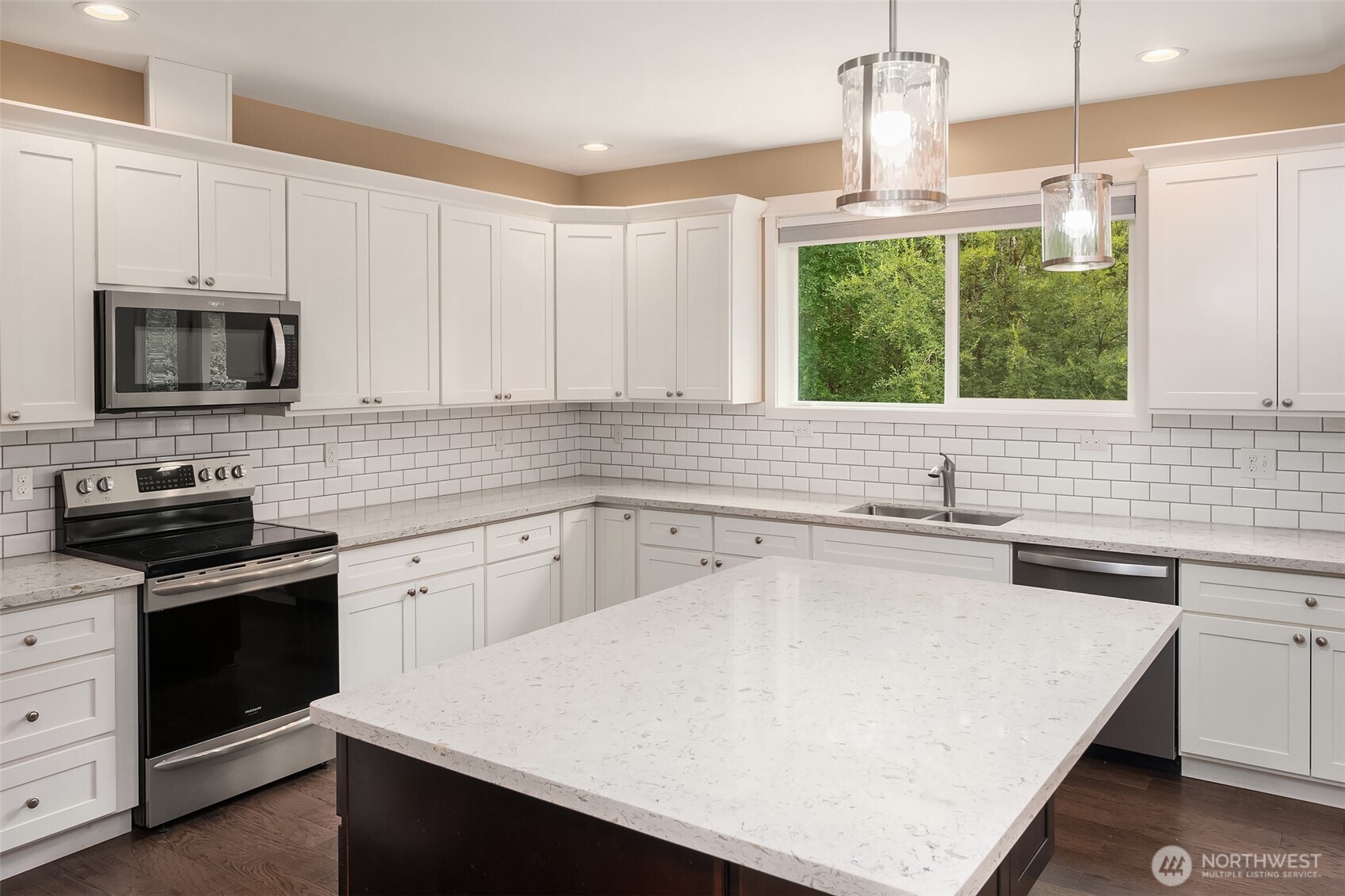 216 Cornwall Road Northwest Lakebay, WA 98349 - Photo 12 of 34 a kitchen with stainless steel appliances a stove sink microwave and cabinets