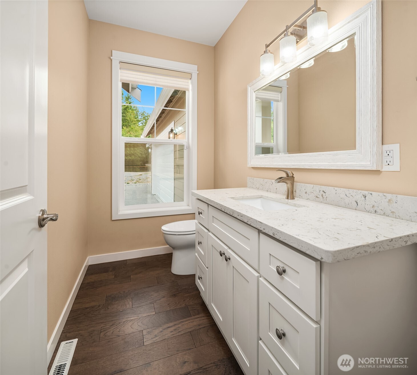 216 Cornwall Road Northwest Lakebay, WA 98349 - Photo 22 of 34 a bathroom with a granite countertop sink a toilet and a window